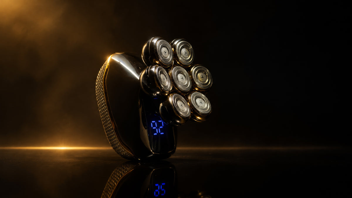 A metallic gold and black electric shaver with a digital blue display showing '9:02', set against a dark, moody background with dramatic golden lighting and a reflective surface below.